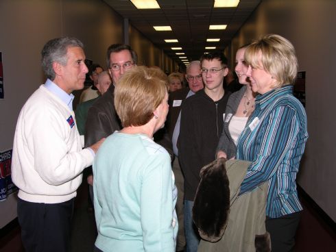 Chris and Sarah Lauzen at the front of greeting line as people group to meet the candidate.