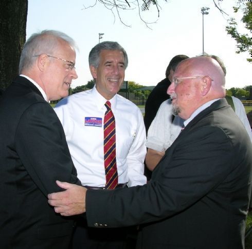 State Senator John Milner is greeted by Chris Lauzen and campaign supporter Dick Hawks prior to the campaign announcement. 