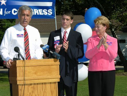 Chris receives applause from his son, Rob, and wife, Sarah, during his speech announcing his candidacy for United State Congress.